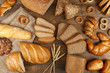 Different bread on a dark wooden table