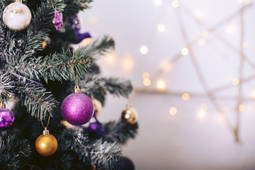 christmas tree with colorful toys and a star-shaped garland