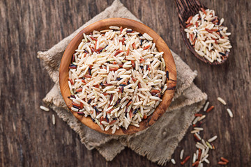 mix of brown, red and wild rice in bowl