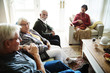 © Rawpixel.com - Senior people sitting together in a living room