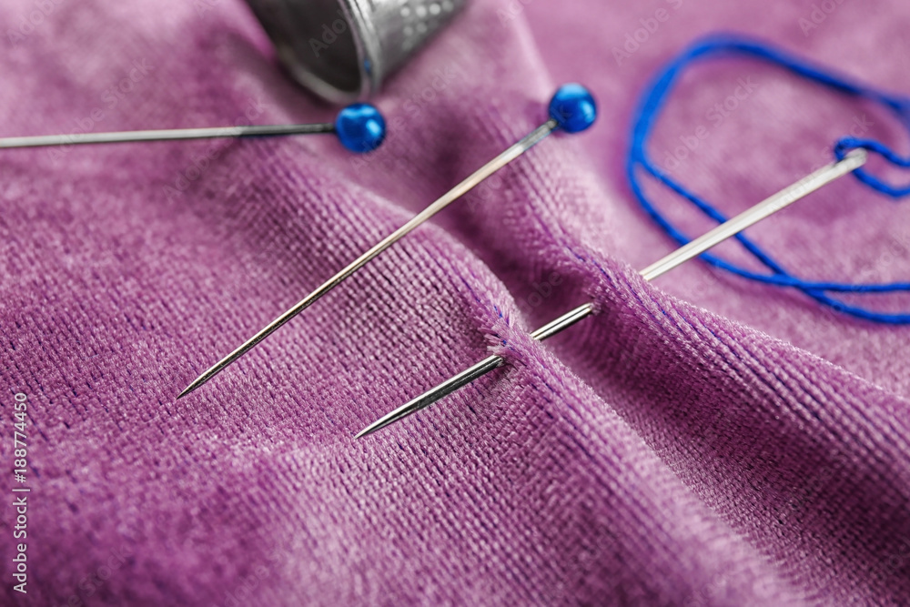 Fabric with sewing accessories, closeup