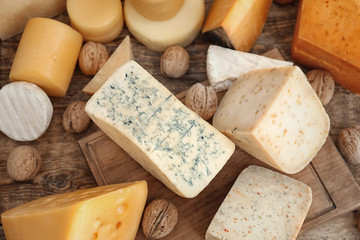 Wall Mural - Variety of cheese on wooden background