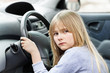 © Scandinav - Little blond girl behind steering wheel