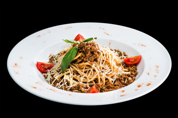 Sticker - Pasta with meat, tomato and cheese in a white plate isolated on black background