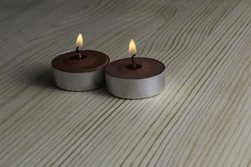 Candles on a wooden background.