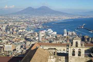  Scenic skyline view over the historic center of Naples, Italy with a view of Mount Vesuvius in the background