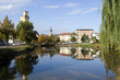 Altenburg / Germany: Autumnal view over the „Little Pond“ to waterworks tower, St. Bartholomew steeple and Martin Luther School