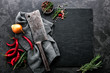 dark culinary background with empty black slate board and space for text recipe or meat menu