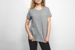 © LIGHTFIELD STUDIOS - cropped shot of woman in blank grey t-shirt on white