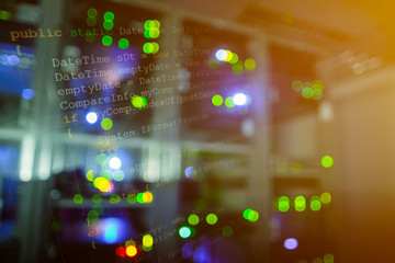 Wall Mural - double exposure of computer language source code on computer monitor and network server room with co