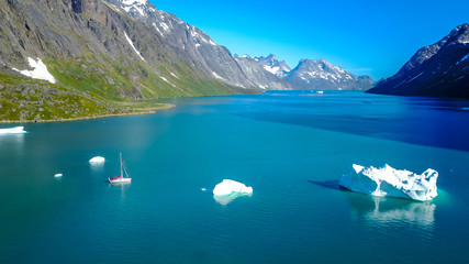 Wall Mural - yacht and iceberg. amazing aerophoto. greenland nature fjord.