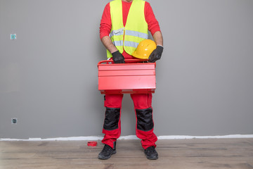 Wall Mural - Builder handyman with construction tools.
