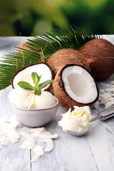 Sticker - Bowl with balls of coconut ice cream and desiccated coconut on wooden table