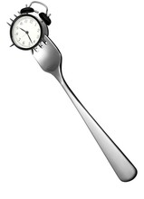 Fork Stuck In Silver Alarm Clock On White Background