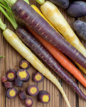 Fresh Organic Rainbow Carrots And Purple Potatoes