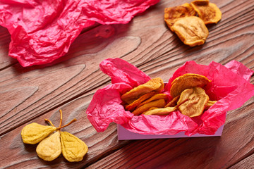 Sticker - Dried fruits on wooden background