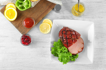 Poster - Composition with traditional sliced honey baked ham on table