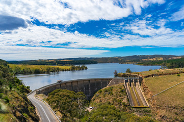 Aerial view on water reservoir, dam on sunny day