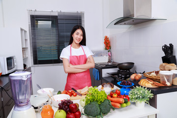 Sticker - woman standing with arms crossed in kitchen room