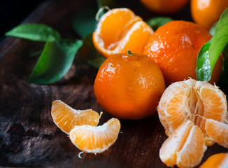 Wall Mural - Tangerines. Fresh organic ripe mandarines closeup on wooden table. Top view