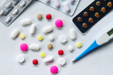 Wall Mural - Top view of the pills on the white background, Pack of tablet drug and capsule pills on the floor, Pile of the drug and pills on the white background.