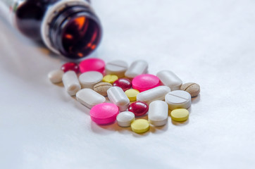 Wall Mural - Close-up of the pills on the white background, The drug and capsule pills on the floor, Pile of the drug and pills on the white background.