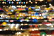 © yanadhorn - defocused of multi color light and plastic roof of ratchada train night market,bangkok. for christmas and new year abstract background concept.