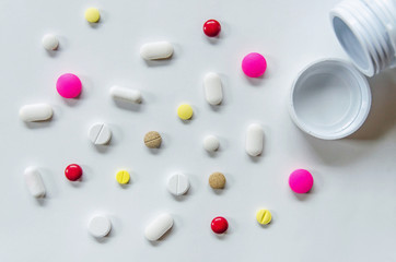 Wall Mural - Top view of the pills on the white background, The drug and capsule pills on the floor, Pile of the drug and pills on the white background.