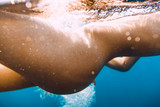 Underwater photo with naked woman body. Attractive female body