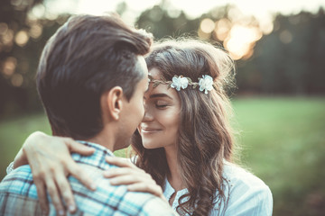 Wall Mural - Young lovely couple at sunset