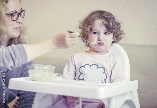 Fotografia, Obraz The two-year-old child is naughty and refuses to eat