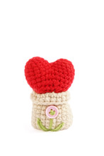 Crochet Red Heart. A Crochet Of Mini Heart In Small Sackcloth Bag Isolated On A White Background