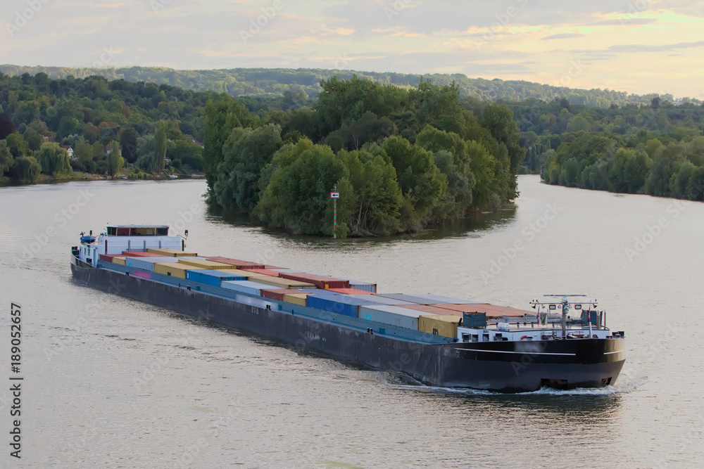 Efficient and eco-responsible supply using barges and river - obrazy, fototapety, plakaty 