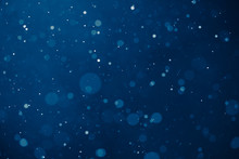 Blue Light Background With Snowflakes Particles