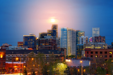 Sticker - Denver Colorado colorful night skyline with glowing full moon above the downtown skyscrapers at dusk