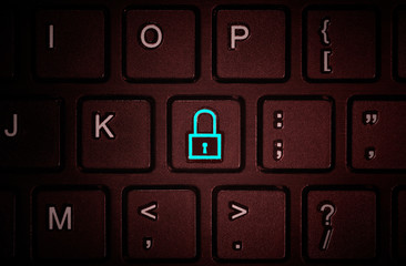 Button with the symbol of the closed lock on the keyboard. Concept of network security, virus protection, data protection.