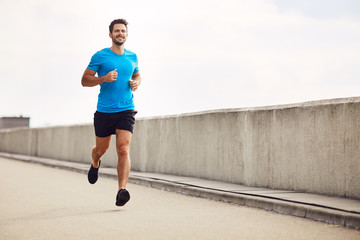 athletic young man running