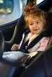 © Lucky Fenix - family, transport, road trip concept - child sitting in the car seat.