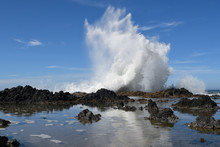 Sea Spray From A Ocean Wave Splashing Dramatically Upa Against  A Rocky Shoreline In The Cape Perpetua Scenic Area Along The Oregon Coast