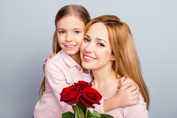 Canvas Print - Care trust support parenthood day-off mother's day spring bliss delight pleasure peace people concept. Close up portrait of sweet small kid sitting on nice mommy's hands isolated on gray background