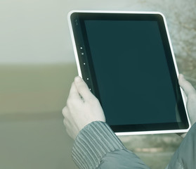 Wall Mural - Close up hand woman holding tablet on isolated.