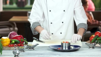 Wall Mural - Chef preparing nicoise salad. Quail egg and fresh vegetable.