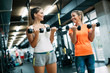 © NDABCREATIVITY - Beautiful women working out in gym together
