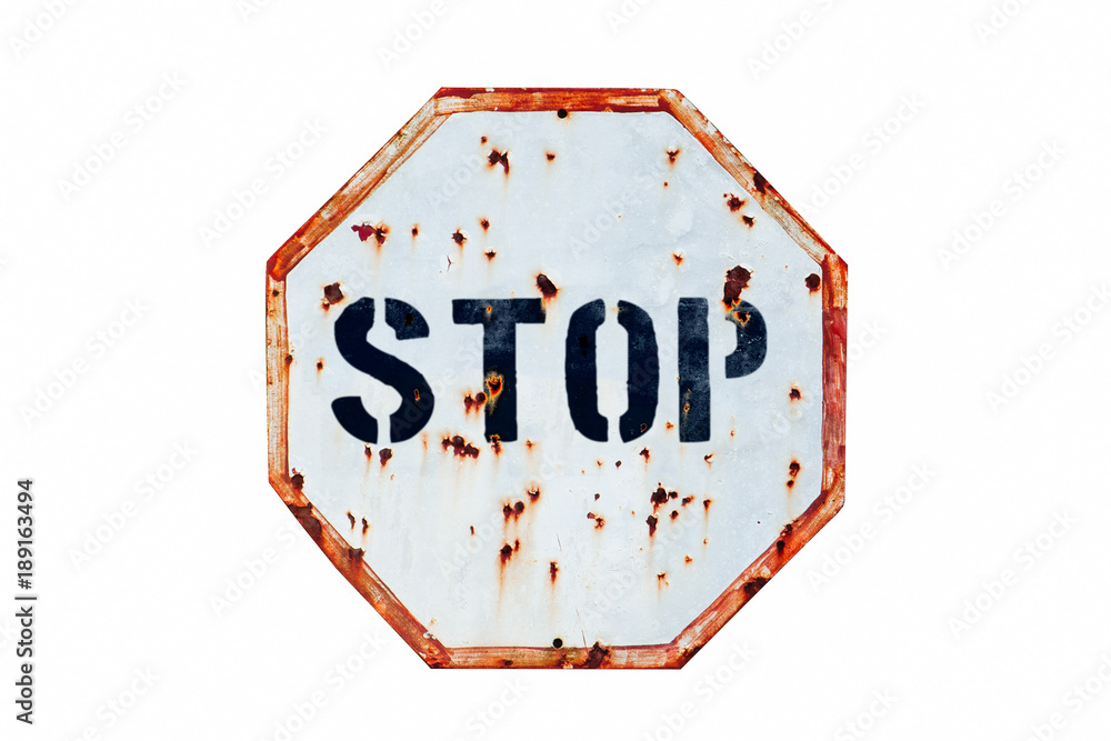 Stop written in bold letters in a rusty and grungy white and red old ...