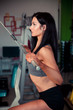 © Samo Trebizan - Beautiful hispanic woman works out in fitness gym