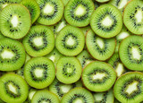 a lot of kiwi slices as textured background