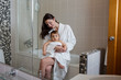 © saulich84 - mother in a Bathrobe and with a child