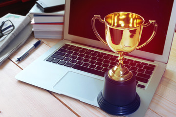 Wall Mural - trophy on working table , winner concept.