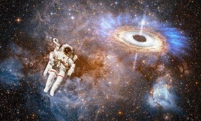 Wall Mural - astronaut in outer space against colorful storm galaxy. (elements of this image furnished by nasa)