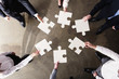 © alphaspirit - Teamwork of partners. Concept of integration and startup with puzzle pieces